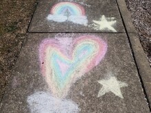 Yellow Stars And Rainbow Heart Of Chalk On Grey Sidewalk