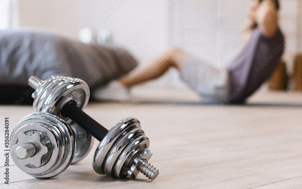 Unrecognizable Guy Doing Abs Exercise Training At Home, Shallow Depth