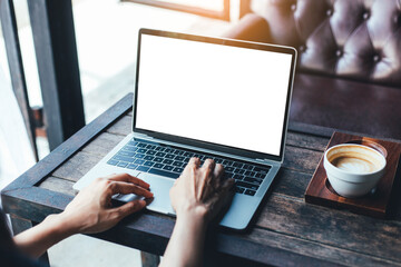 computer mockup image blank screen.hand woman work using laptop with white background for advertising,contact business search information on desk at coffee shop.marketing and creative design