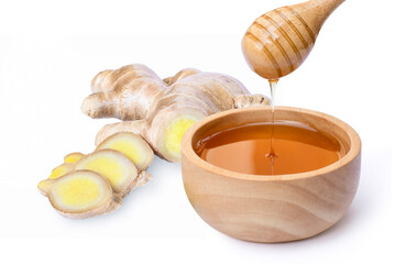 Wall Mural - Closeup fresh organic ginger roote and pure honey in wooden bowl isolated on white background.