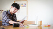 © wattana - Business working in office with documents and laptop people Consulting and business planning.