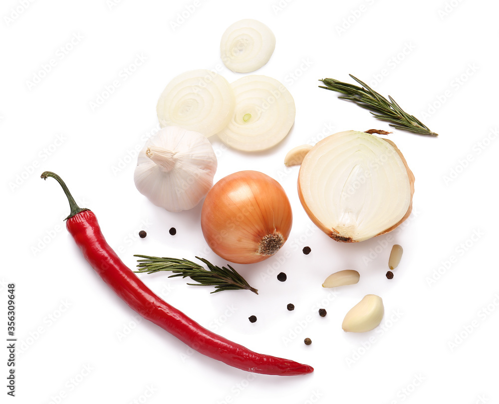 Fresh raw onion, vegetables and spices on white background