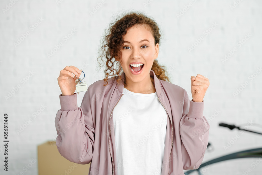 Young woman in her new flat on moving day