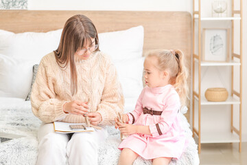 Sticker - Working mother with her little daughter at home