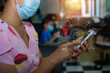 © maeching - woman using mobile payments online shopping and icon customer network connection.