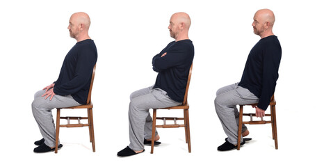 Wall Mural - group of same man in pajamas sitting o a chair on white background, side view