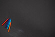 © epovdima - Black board background chalkboard with colored crayons for drawing. Free space