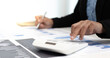 © Puwasit Inyavileart - Businesswomen are calculating finances and analyzing market data with graphs and laptops at work, Business Financing Accounting Banking and tax system Concept.