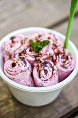 Aufkleber - Berry ice cream with mint leaf on gray wooden background