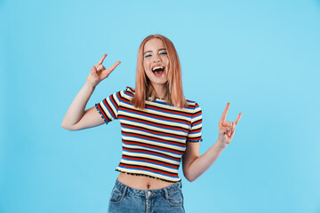 Sticker - Image of excited beautiful girl laughing and making horns with fingers