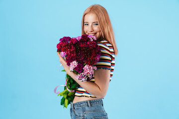 Poster - Image of cheerful beautiful pretty girl posing with flowers and smiling