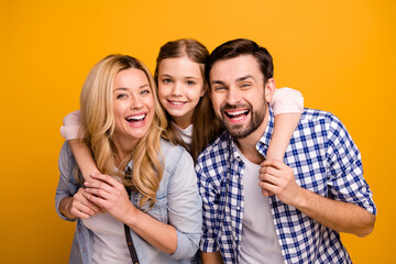 Photo wife beautiful mother lady husband dad guy couple carry little school girl daughter piggyback happy together play weekend laughing wear casual clothes isolated yellow color background