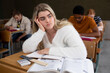 © Wavebreak Media - Front view of student thoughtful in class