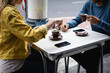 © Wavebreak Media - Caucasian couple in the city sitting at a coffee terrace