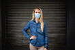 © Wavebreak Media - Caucasian woman wearing a covid19 coronavirus mask outside