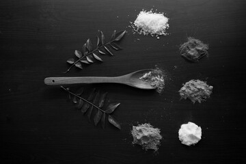 Food ingredients in tabletop with nice colour and spicy, chilley, spoon, prawns, tasty, carrot, ginger, curry leaves, lemon, garlic, sugar.