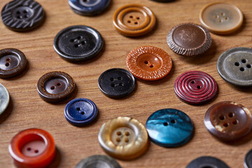 Fototapete - Background and texture of multicolored antique buttons