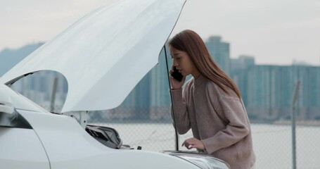 Wall Mural - Woman talk to mobile phone with car problem