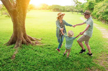 Wall Mural - happy Asian family playing together at  park