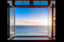 View From A Dark Room To The Sea Through An Open Window