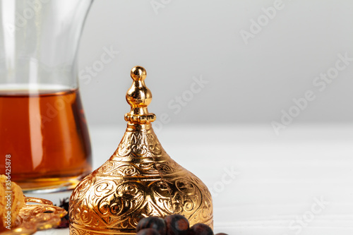Cup of tea with islamic pray beads