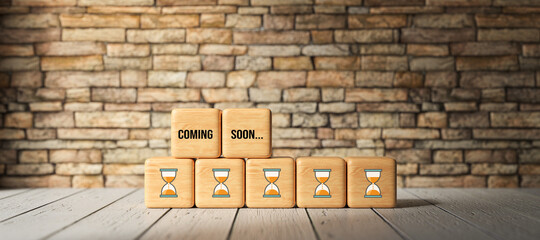 Wall Mural - cubes with message COMING SOON in front of a brick wall