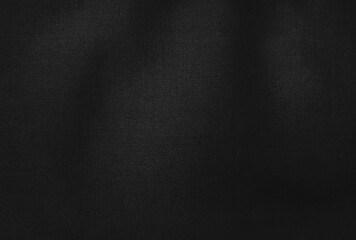 abstract luxury black satin fabric background. wavy dark fabric background with space for text.