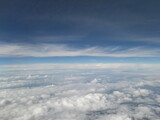 Fototapeta Niebo - Blue sky above the clouds, lots of cumulus clouds.