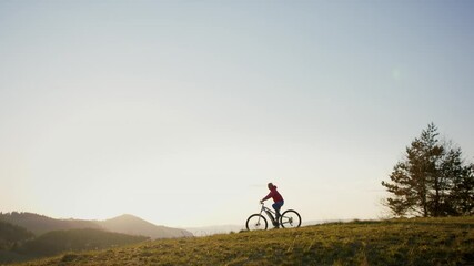 Wall Mural - Active senior woman with e-bike cycling outdoors in nature.