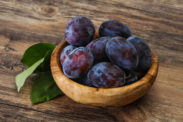 Ripe plum heap in the basket