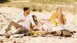 © Prostock-studio - Happy Family Having Picnic Talking And Eating Outside, Panorama