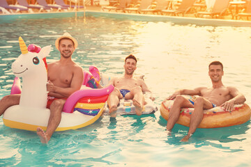 Sticker - Happy young friends relaxing in swimming pool