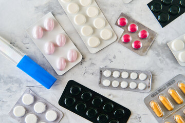 Wall Mural - Pills capsules medicine health on light background top view, medical pharmacy concept. Different pills on light background with copy space.