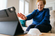 © Alvaro Sanchez/ADDICTIVE STOCK - Senior woman communicating with friend during video chat on laptop
