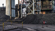 © Inigo Calles/ADDICTIVE STOCK - Heaps of coal placed in industrial area at factory for producing coke