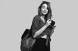 © micro - Smiling student hipster girl with backpack and camera going on a vacation
