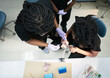 © Victor Bordera/ADDICTIVE STOCK - Black colleagues examining denture in laboratory