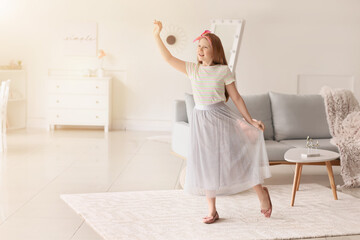 Canvas Print - Cute redhead girl dancing at home