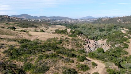 Wall Mural - Aerial view of Los Penasquitos Canyon Preserve during dry season. Urban park with mountain, forest and trails in San Diego, California. USA