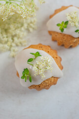 Wall Mural - home made elderflower lemon cupcakes on a table