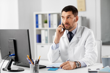 Sticker - healthcare, medicine and people concept - male doctor with clipboard calling on phone at hospital