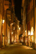 Small alley in Bolzano, Italy in the night with a bicycle