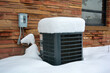 Leinwandbild Motiv Snow Covered Air Conditioner on a Cold Winter Day