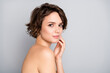 © deagreez - Portrait of pretty charming attractive girl look in mirror touch hands face enjoy her soft ideal perfect skin after anti aging rejuvenation procedure isolated over gray color background