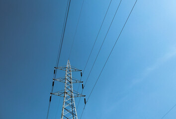 isolated electrical tower in the blue sky