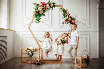 Wall Mural - children with tulips in the photo Studio, beautiful interior, brother and sister, family, spring, March