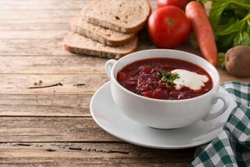 Wall Mural - Traditional Ukrainian Russian borsch. Beetroot soup on wooden table. Copy space