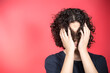 © Ramil - Portrait Of Serious Teenage Boy Standing Against Red Background