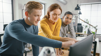 Wall Mural - in the office: three diverse start-up entrepreneurs have meeting and discussion about the project. l