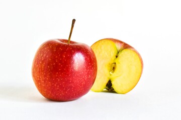 Red juicy apple and sliced ​​apple on a white background. place for text. concept of healthy eating, dieting.